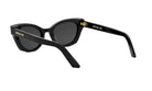 A pair of black cat-eye sunglasses with gold accents, featuring the Christian Dior logo on the temples.