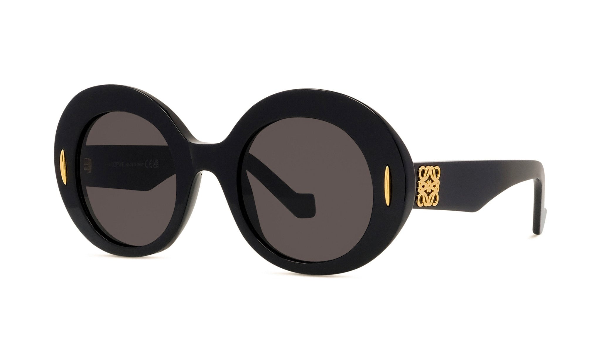 A pair of black round sunglasses with gold accents.