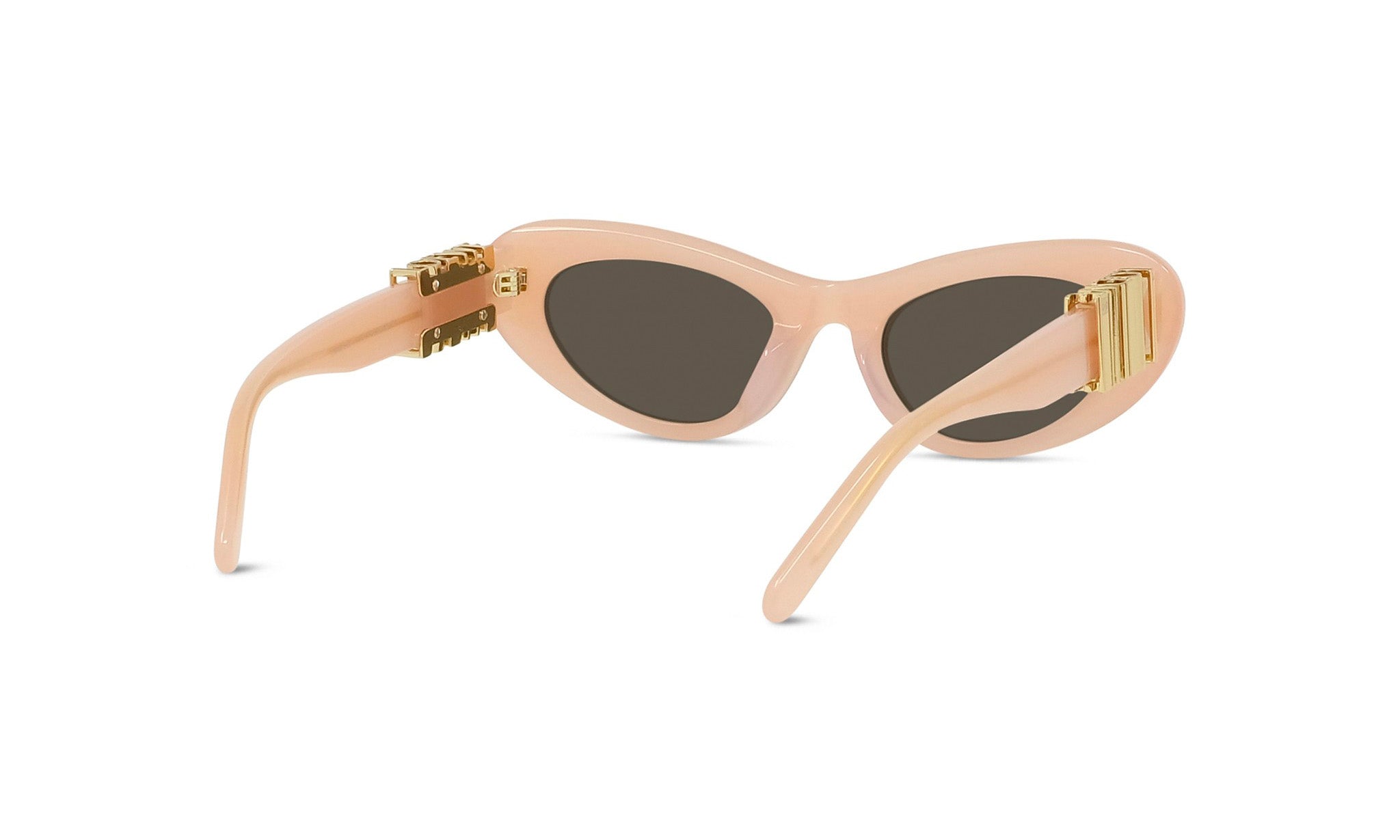 A pair of peach-colored sunglasses with gold-colored metal accents.