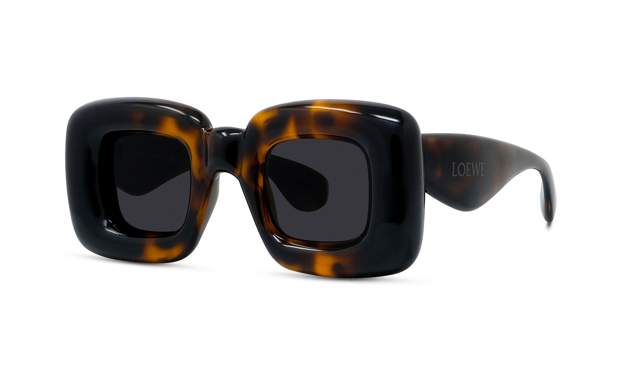A pair of stylish sunglasses with a tortoiseshell frame and dark lenses.
