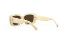 A pair of cream-colored sunglasses with a gold-colored logo on the frame.