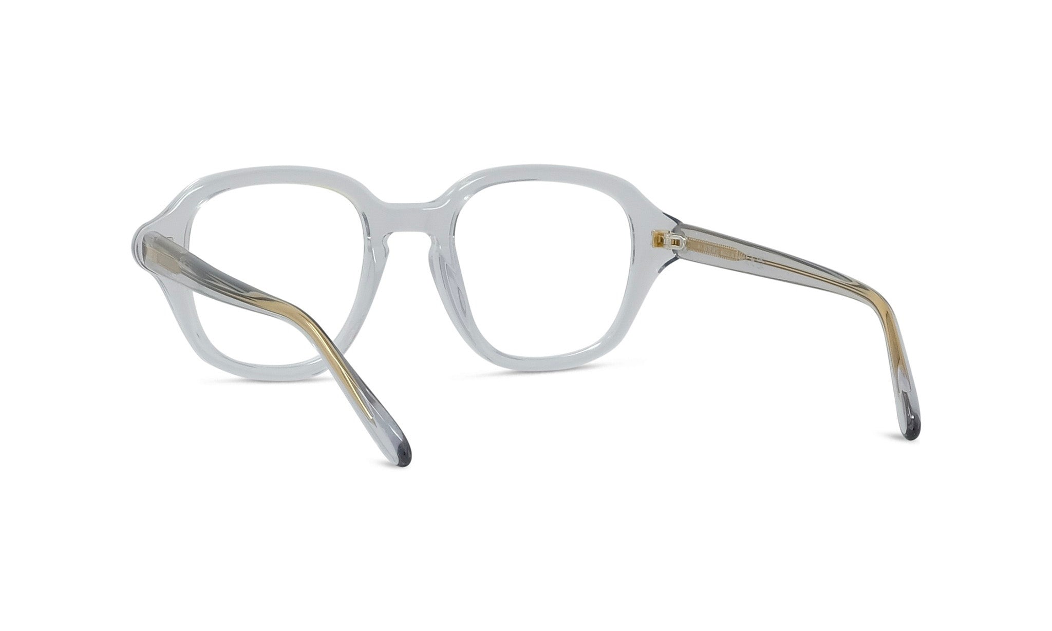 A pair of clear eyeglasses with gold-colored arms.