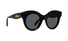 A pair of black cat-eye sunglasses with dark lenses.
