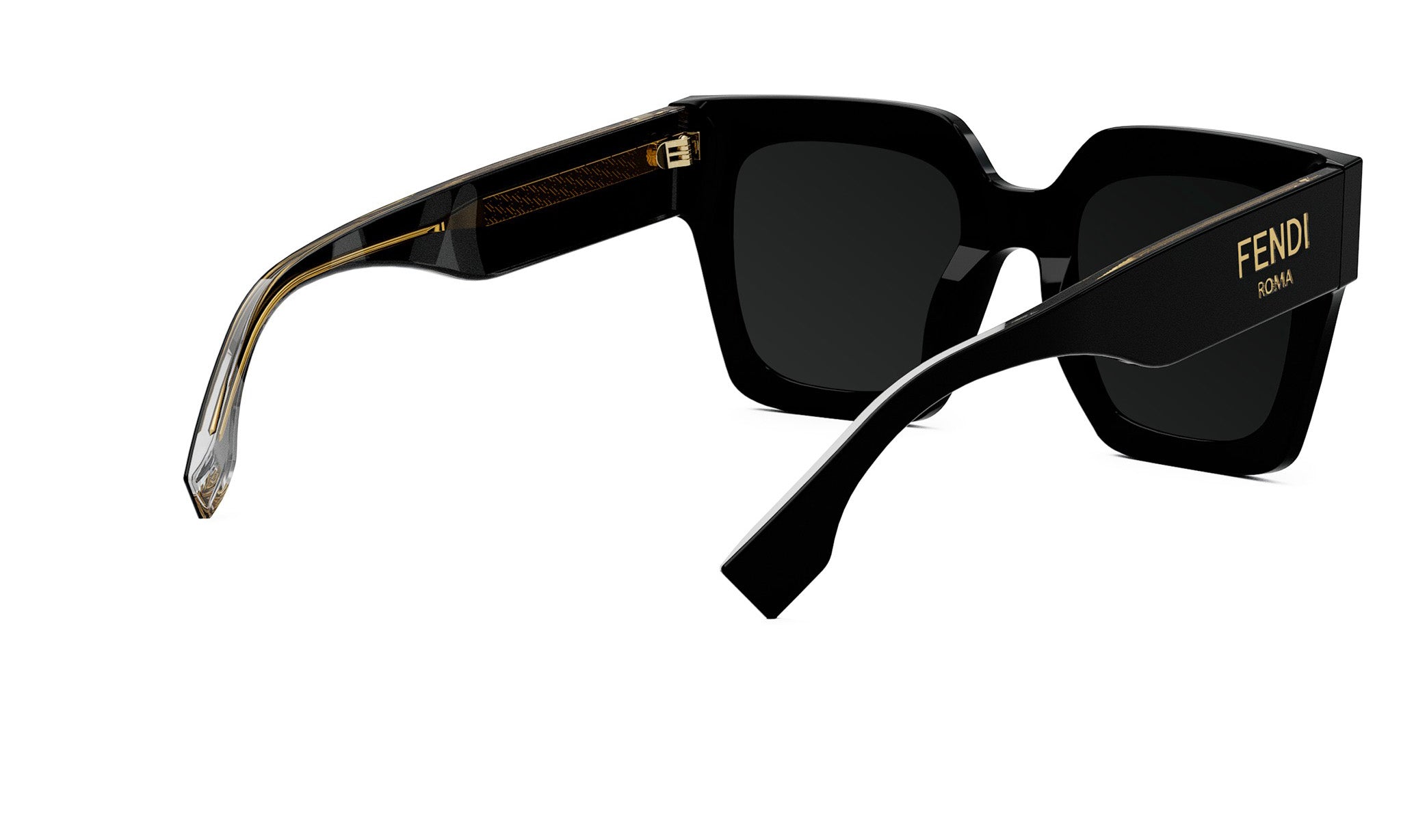 A pair of black sunglasses with gold accents, featuring the Fendi logo on the temples.