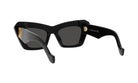A pair of black cat-eye sunglasses with gold accents.