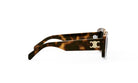 A pair of sunglasses with a tortoiseshell frame and a white logo on the side.