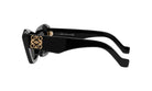 A pair of black sunglasses with a gold logo on the frame.