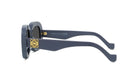 A pair of stylish sunglasses with a dark blue frame and gold accents.
