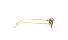 A pair of gold-framed sunglasses with dark lenses is shown against a white background.