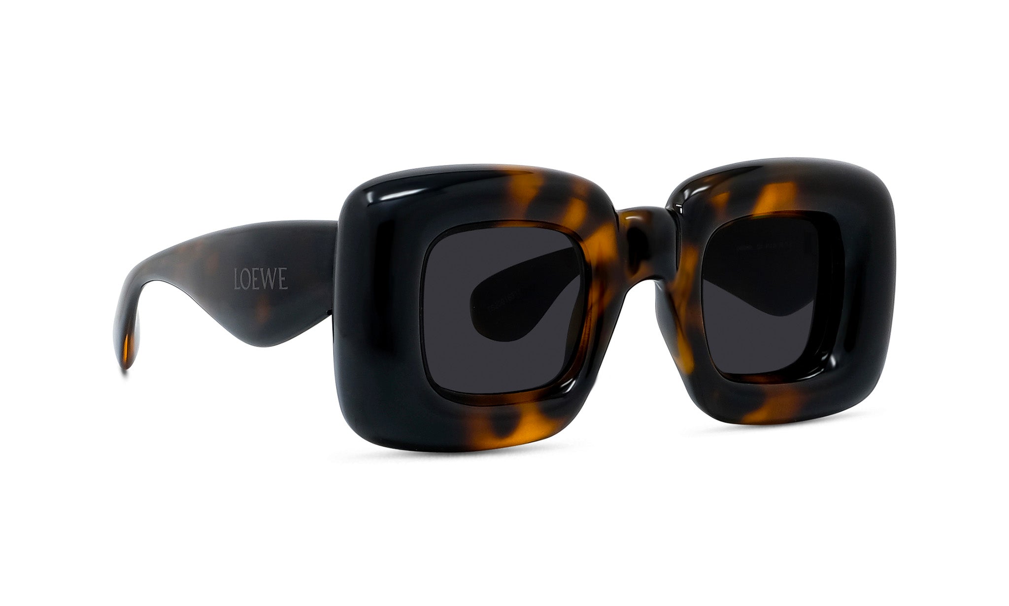 A pair of stylish sunglasses with a tortoiseshell frame and dark lenses.
