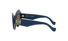 A pair of blue sunglasses with gold accents and a logo on the frame.