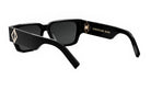 A pair of black sunglasses with a Christian Dior logo on the frame.