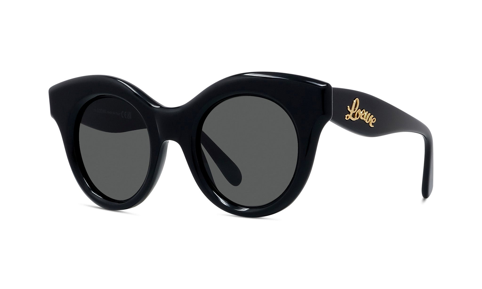 A pair of black cat-eye sunglasses with a gold logo on the frame.