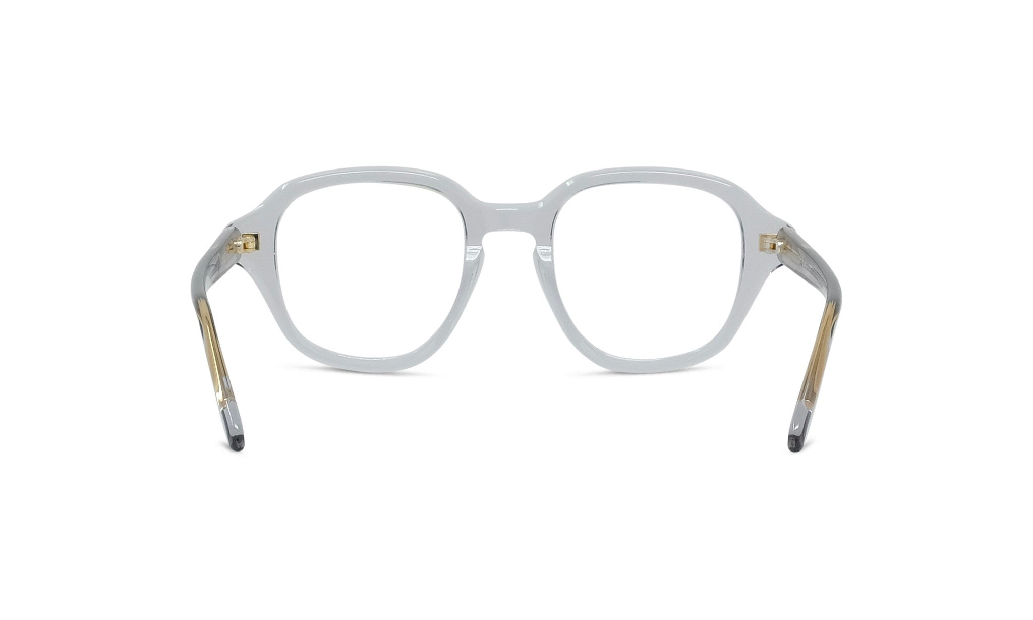 A pair of clear, white-framed glasses with gold accents.