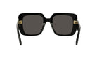 A pair of black sunglasses with gold-colored temples and dark lenses.