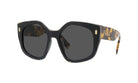 A pair of stylish sunglasses with a tortoiseshell frame and dark lenses.