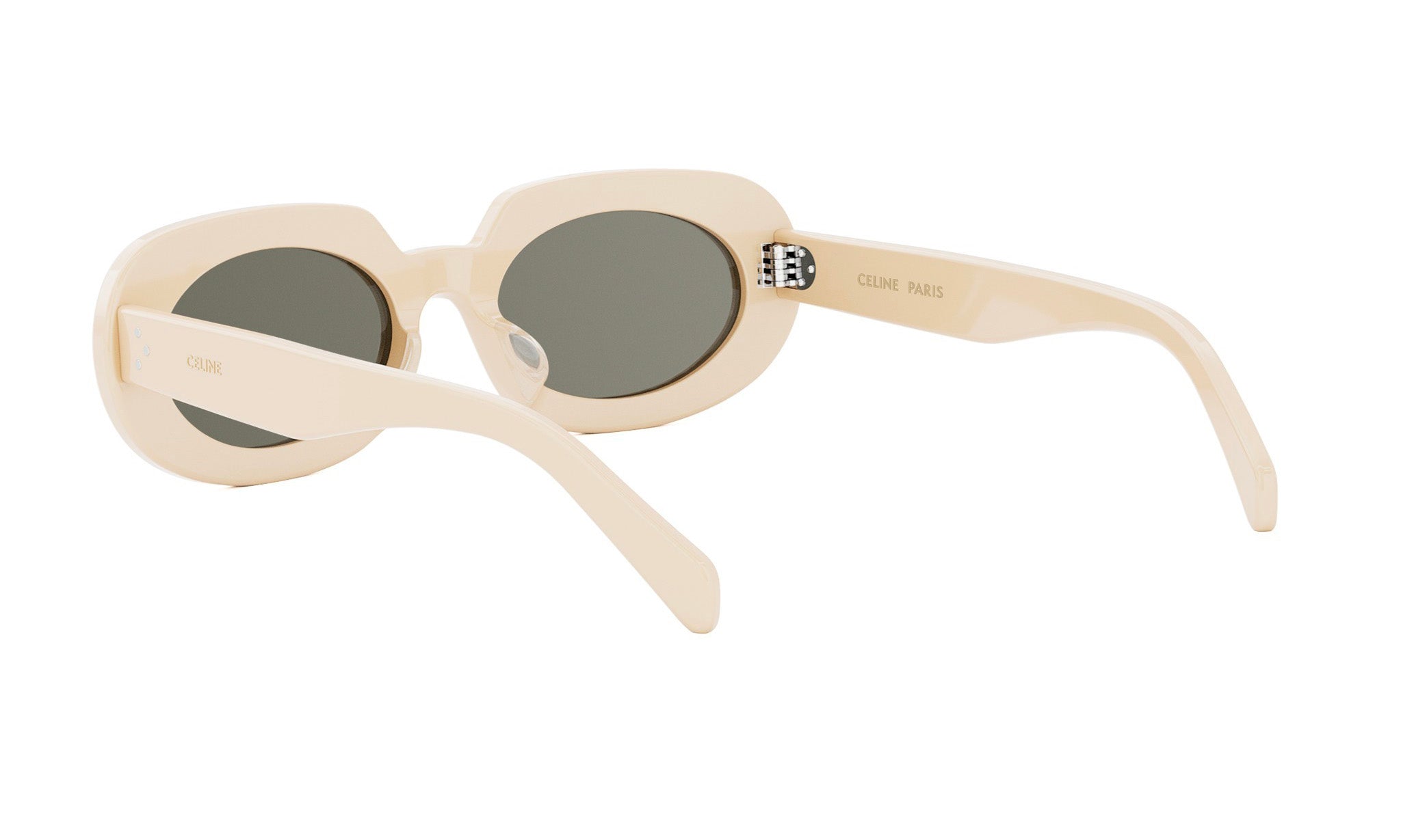 A pair of cream-colored sunglasses with dark lenses.