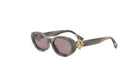 A pair of stylish sunglasses with a gold-colored frame and dark purple lenses.