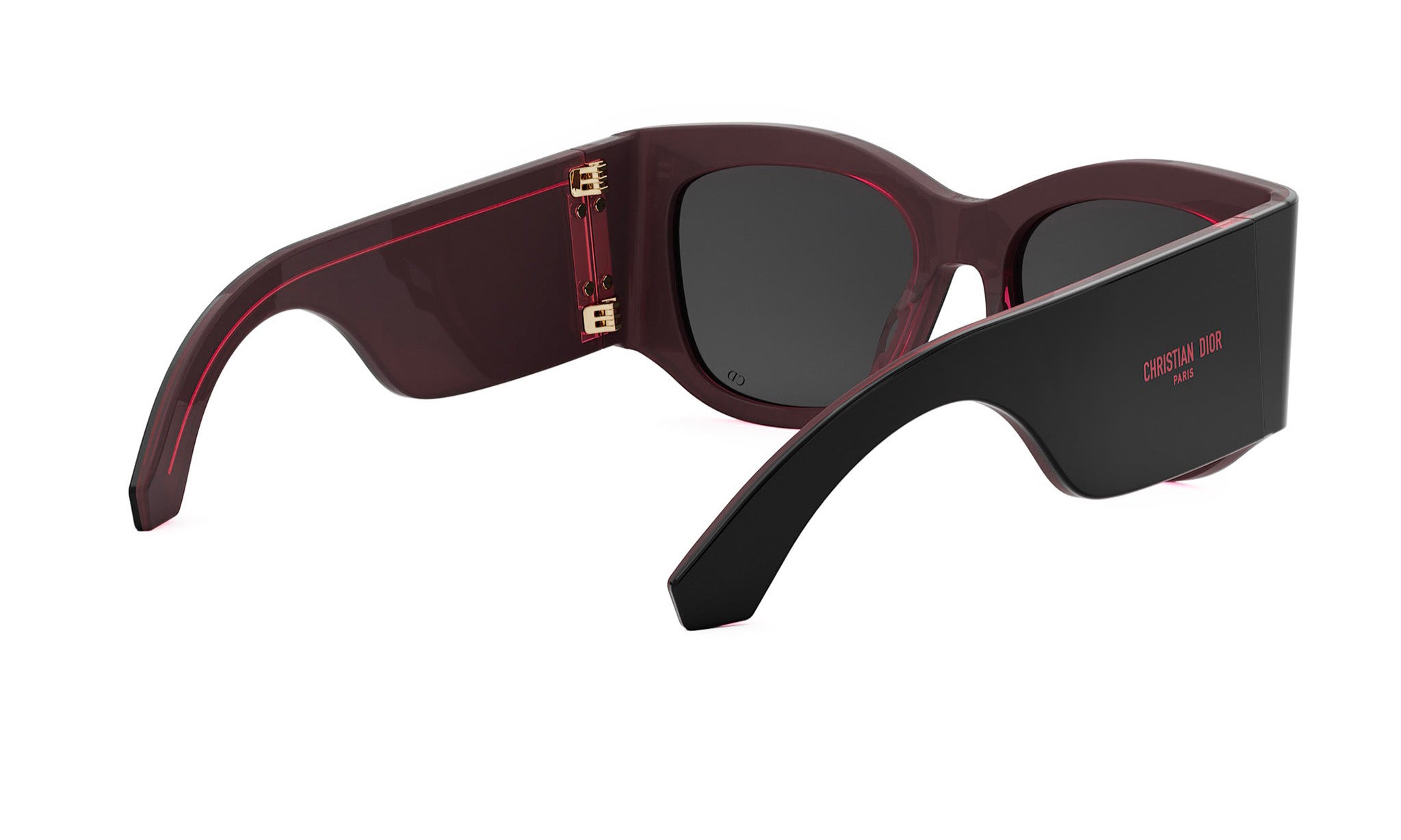A pair of dark-colored sunglasses with a black frame and red accents.