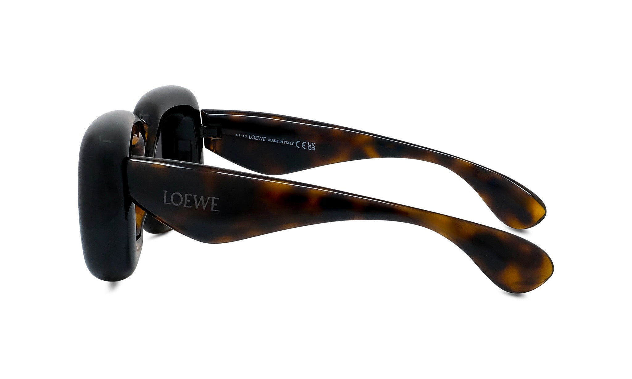 A pair of sunglasses with a tortoiseshell frame and dark lenses.