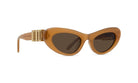 A pair of tan-colored cat-eye sunglasses with gold-colored metal accents.