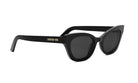 A pair of black cat-eye sunglasses with the brand name "Christian Dior" printed on the frame.