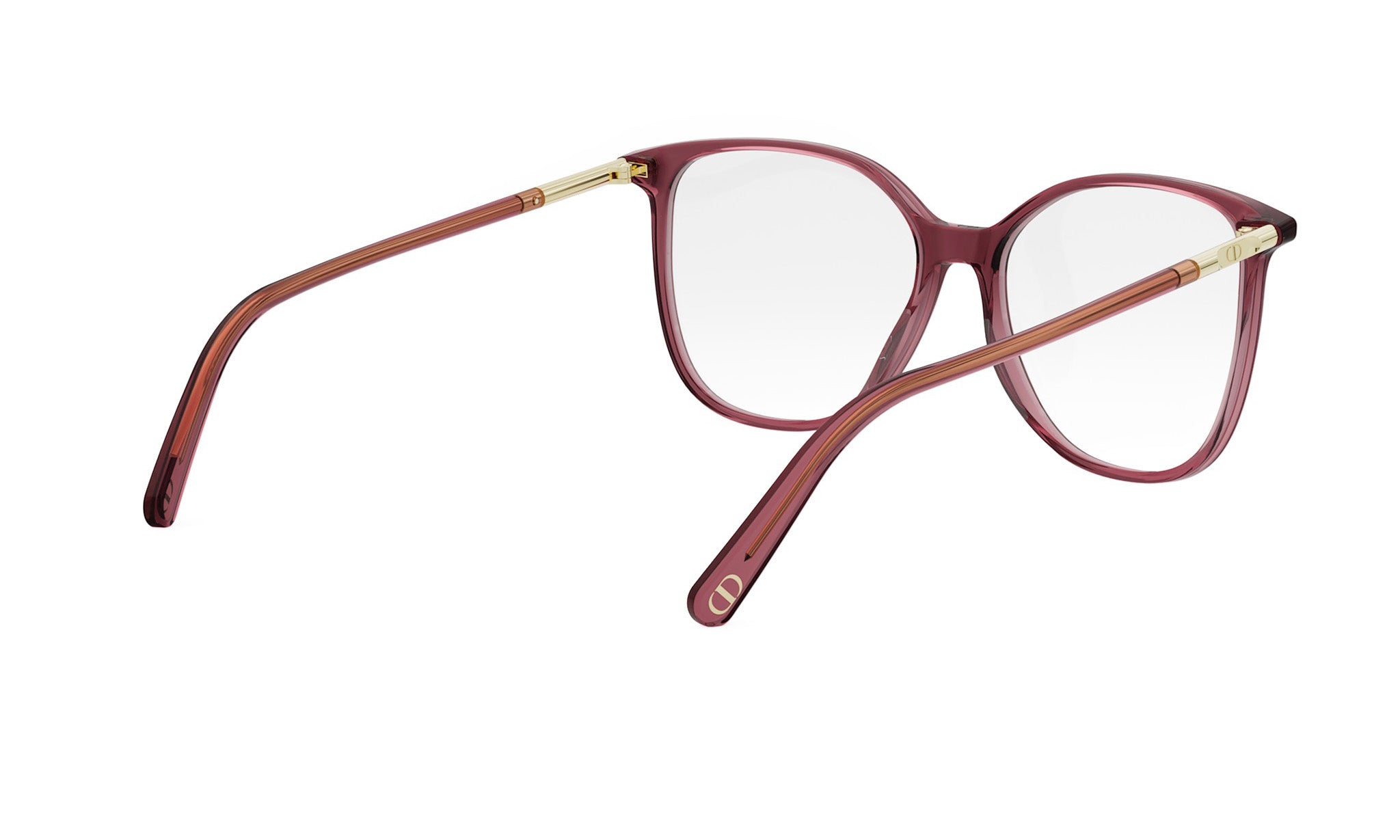 A pair of red-tinted glasses with gold-colored metal arms and temples.