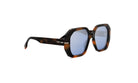 A pair of stylish sunglasses with a tortoiseshell frame and blue lenses.