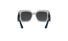 A pair of white and black sunglasses with dark blue frames.