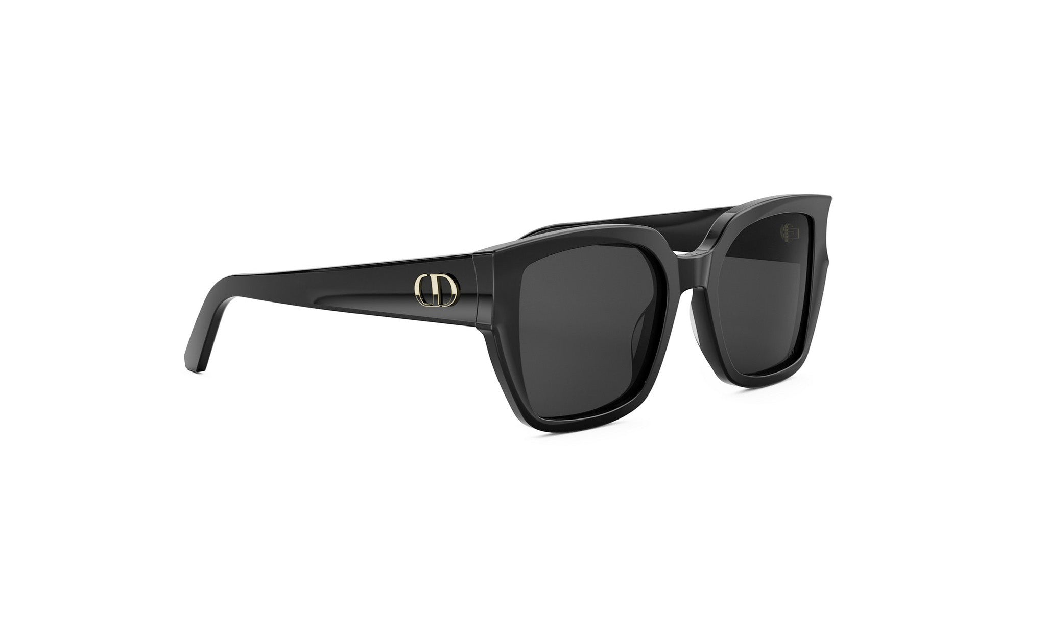 A pair of black sunglasses with a gold logo on the frame.