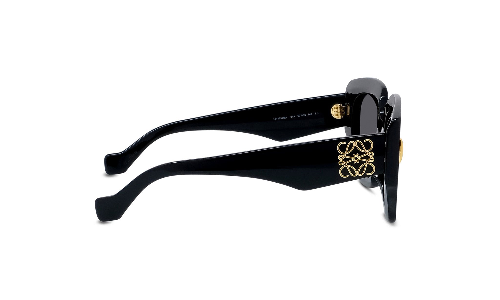 A pair of black sunglasses with gold accents, featuring a distinctive logo on the frame.
