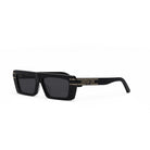 A pair of black sunglasses with gold accents and the brand name "Christian Dior" printed on the frame.