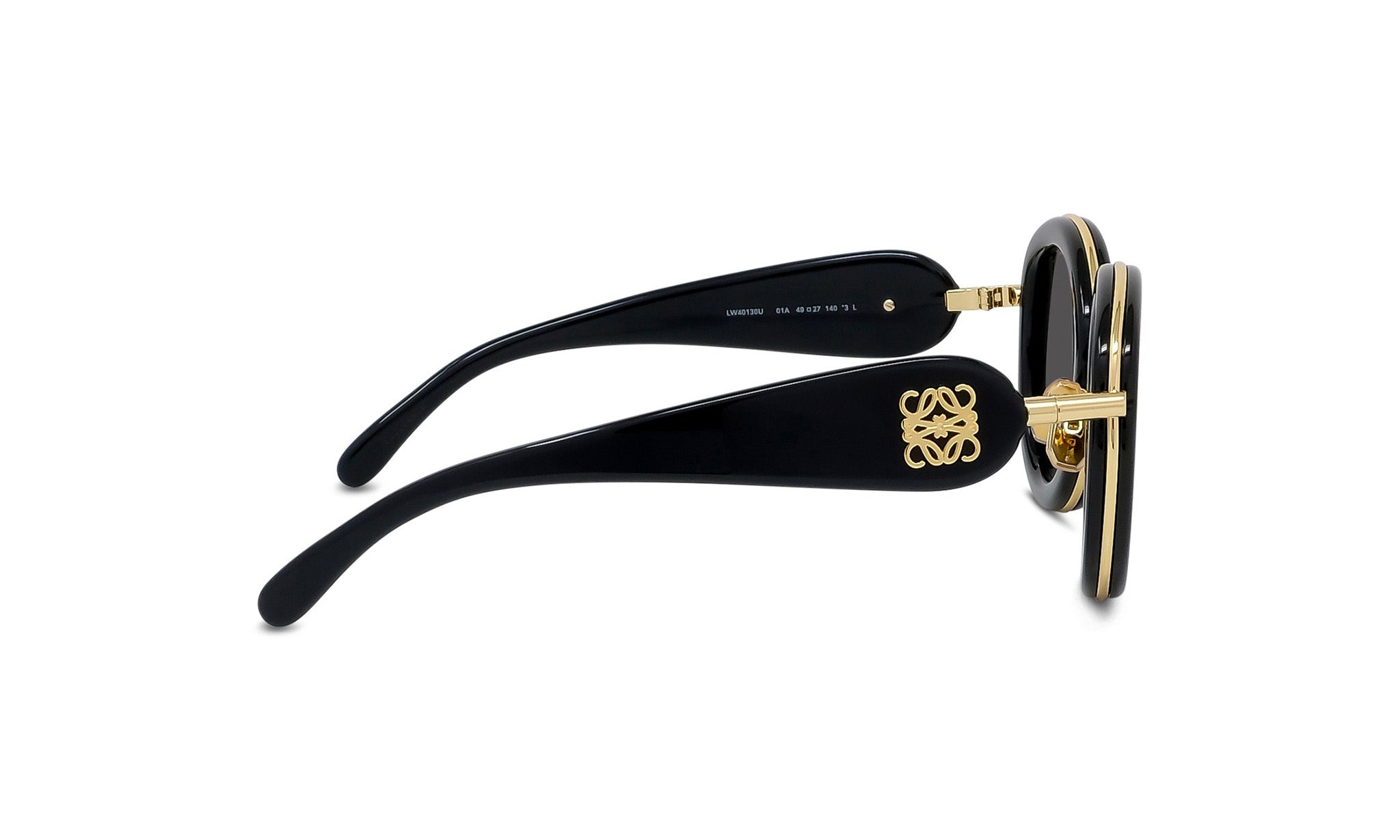 A pair of black sunglasses with gold accents, featuring a distinctive logo on the frame.