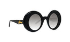 A pair of black, round sunglasses with a gold logo on the frame.