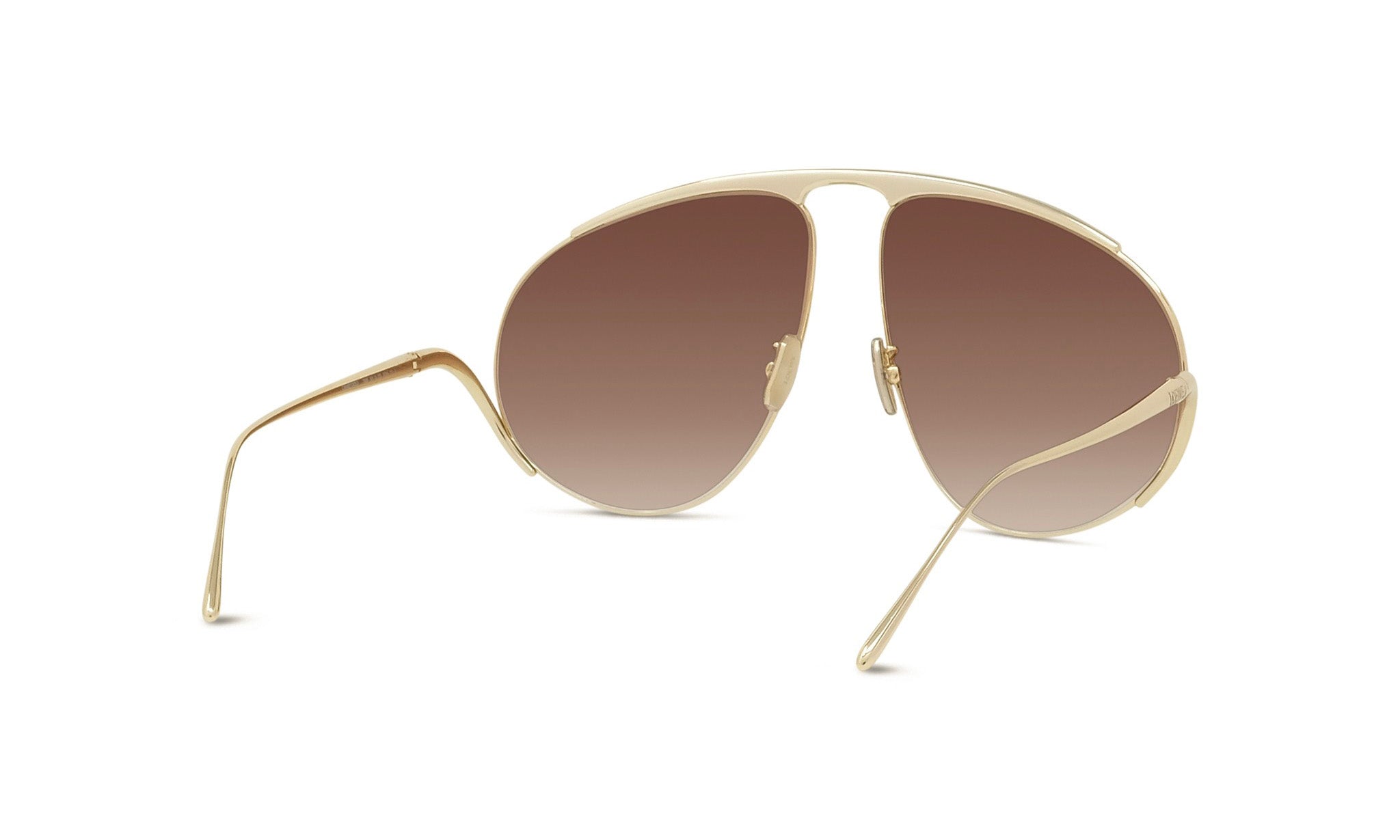 A pair of gold-colored sunglasses with a unique, avant-garde design.
