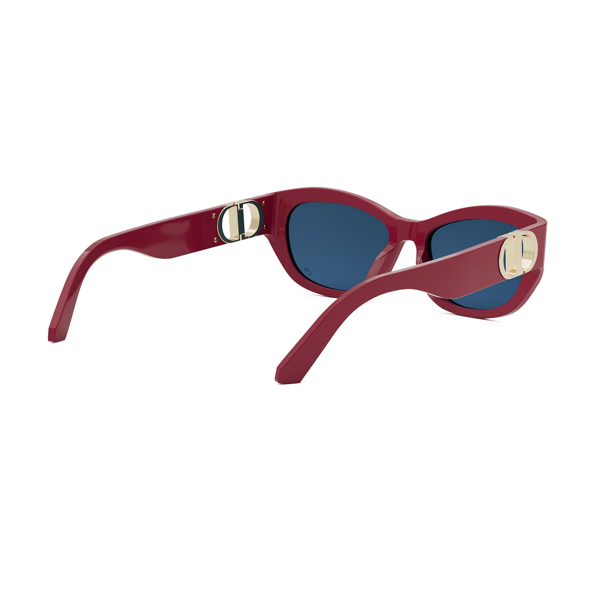 A pair of red sunglasses with blue lenses, featuring a gold-colored Dior logo on the temples.