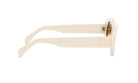 A pair of cream-colored sunglasses with a logo on the frame.