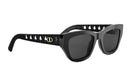 A pair of black sunglasses with a gold Dior logo on the frame.