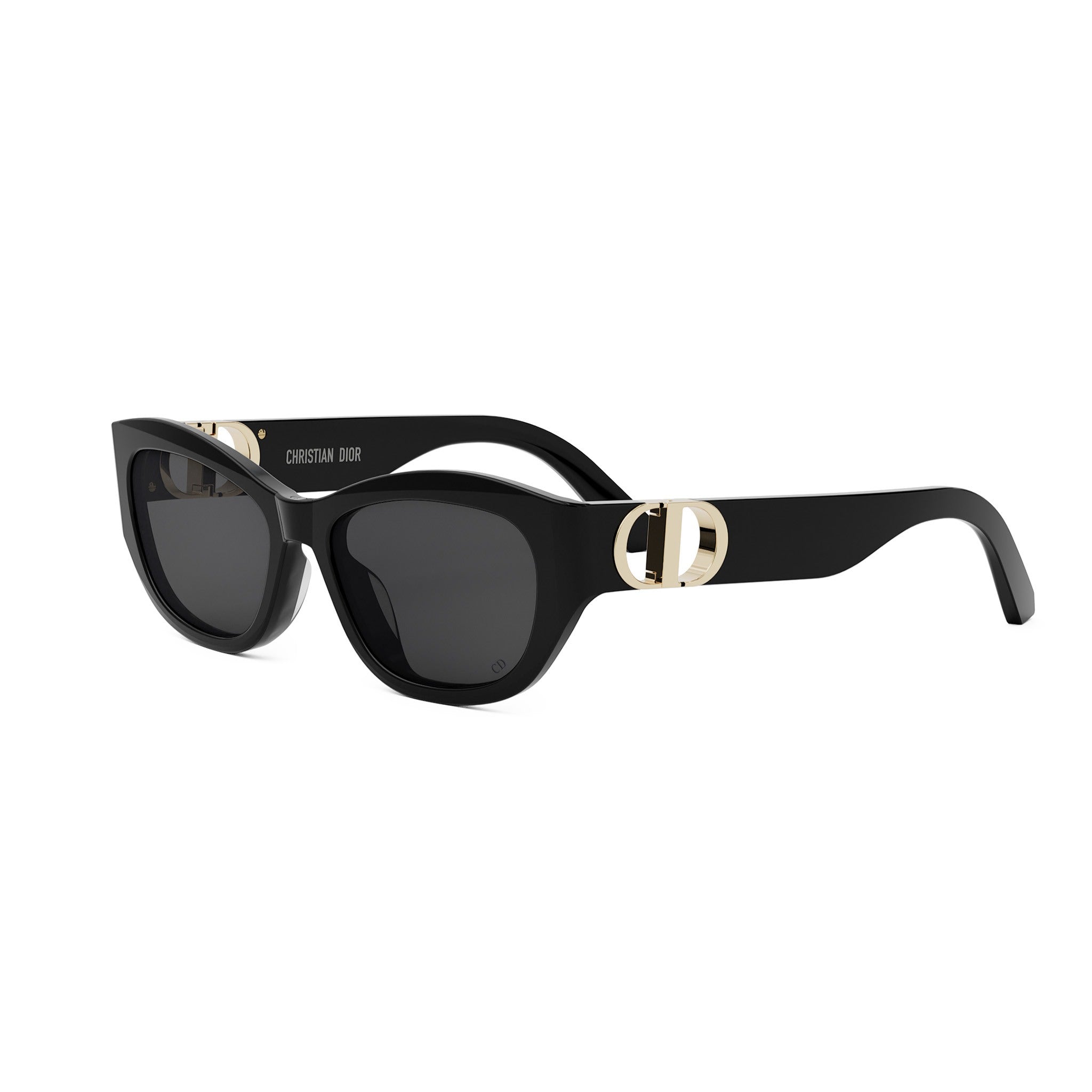 A pair of black sunglasses with a gold-colored logo on the frame.