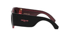 A pair of black sunglasses with red accents, featuring the Christian Dior logo on the frame.