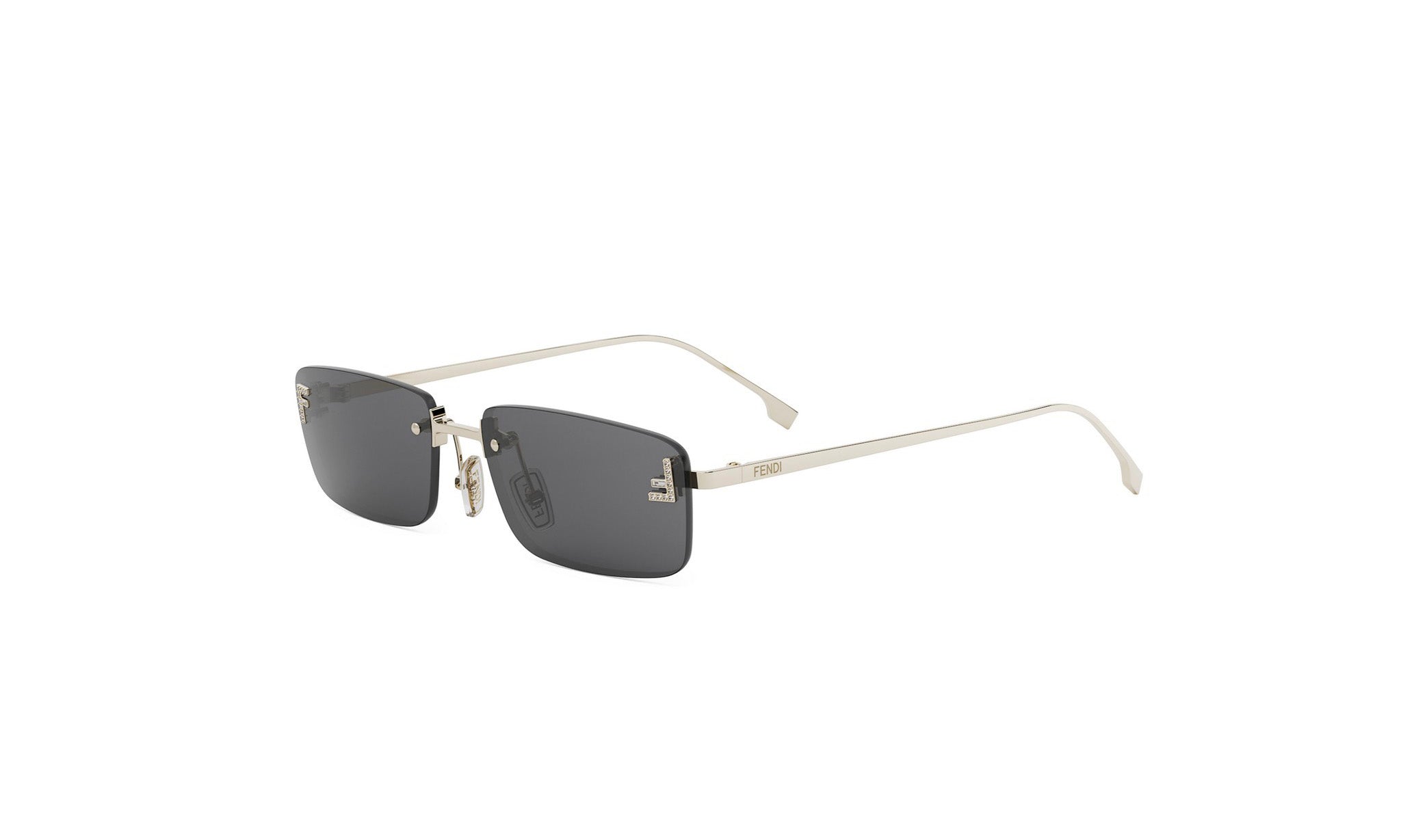 A pair of silver-framed sunglasses with dark lenses.