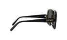 A pair of black sunglasses with gold text on the frame.
