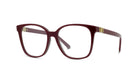 A pair of burgundy-colored eyeglasses with gold accents, featuring a sleek and modern design.