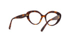 A pair of tortoiseshell-framed glasses with a dark brown frame and a gold-colored temple.
