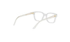 A pair of clear, white-framed glasses with gold accents.