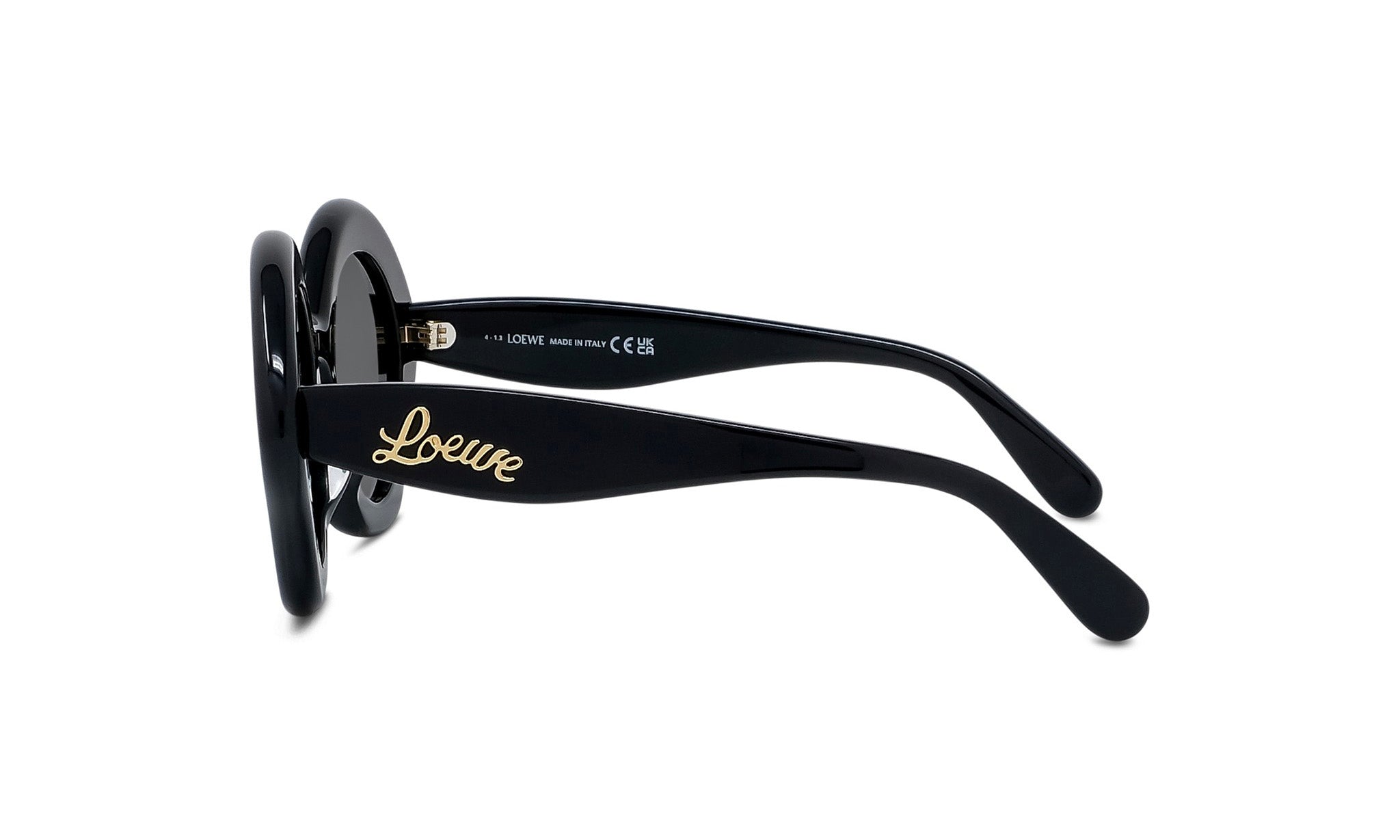 A pair of black sunglasses with gold text on the frame.