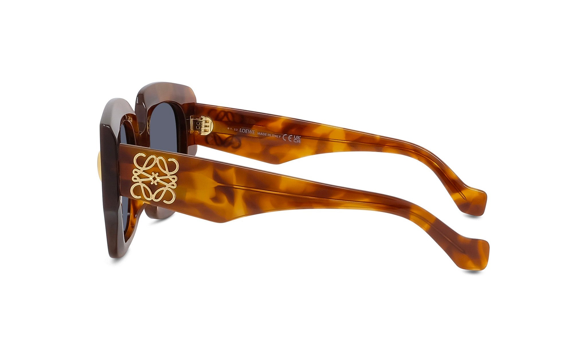 A pair of brown-framed sunglasses with a gold logo on the side.