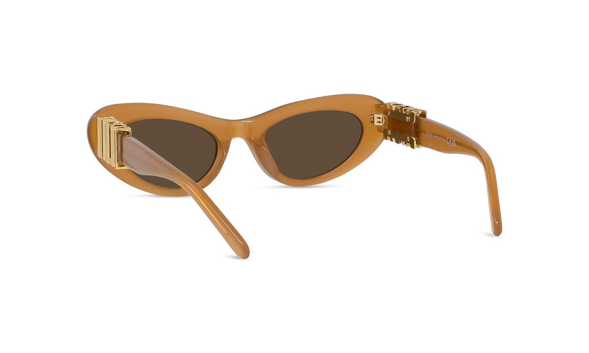 A pair of tan-colored sunglasses with gold-colored metal accents.