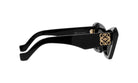 A pair of black sunglasses with a gold logo on the frame.