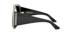 A pair of black sunglasses with gold accents and the name "Christian Dior" printed on the frame.